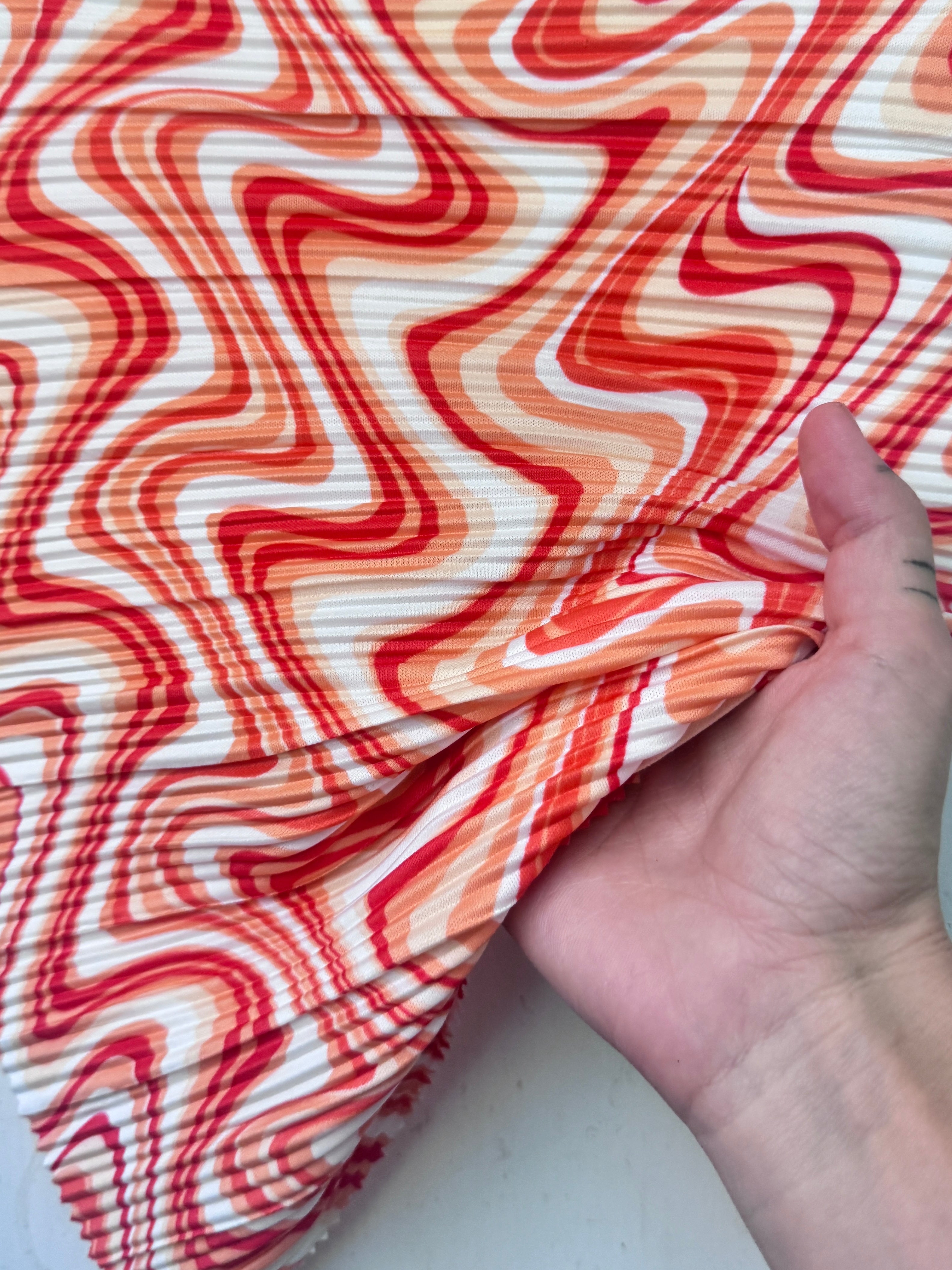 Orange Print Pleated Knit, online textile store, sewing, fabric store, sewing store, cheap fabric store, kiki textiles