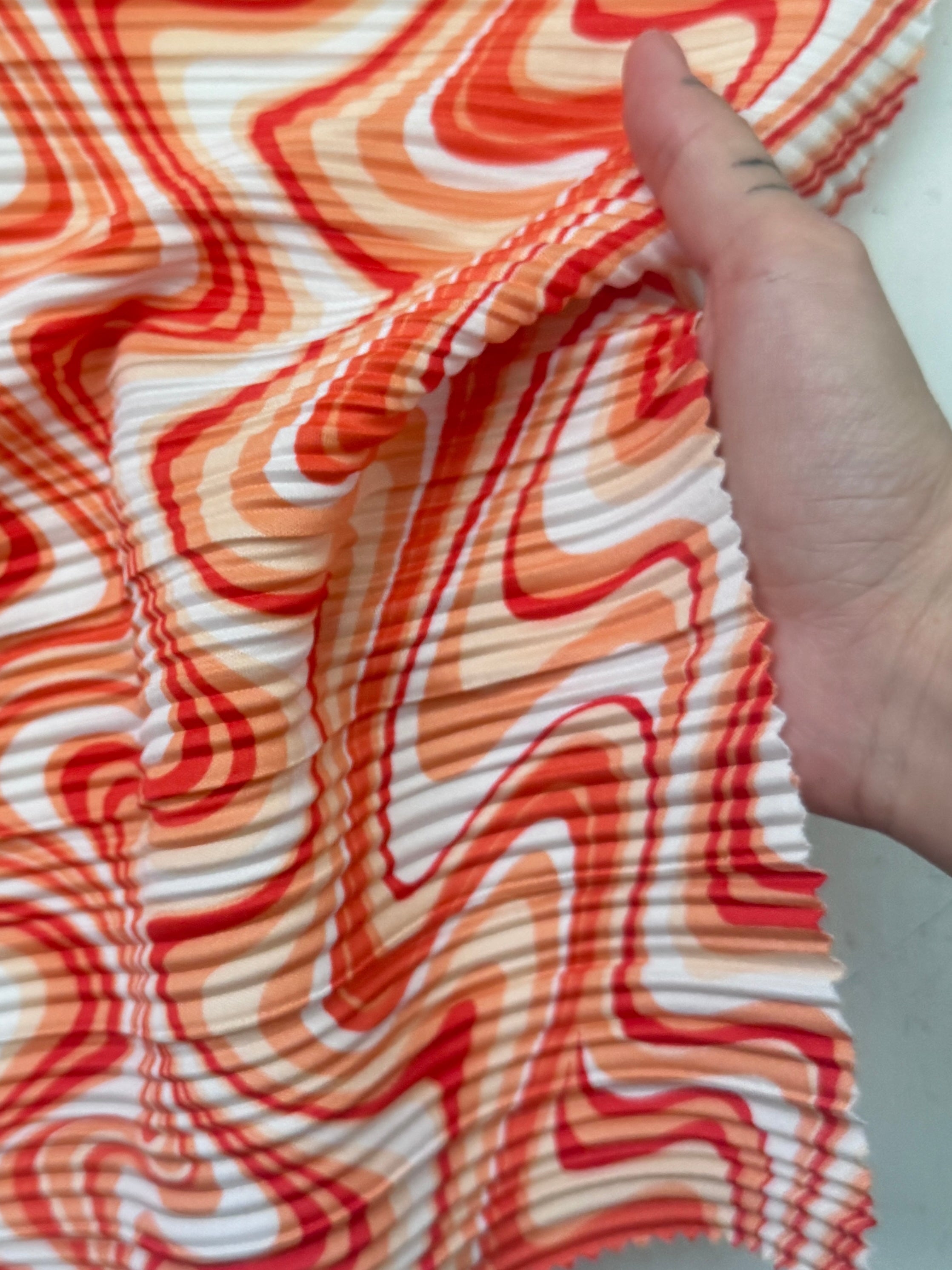 Orange Print Pleated Knit, online textile store, sewing, fabric store, sewing store, cheap fabric store, kiki textiles