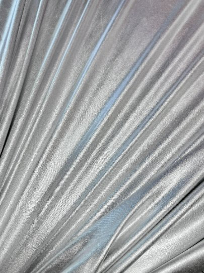 Silver Slinky Foiled Jersey, dark silver Slinky Foiled Jersey, light silver Slinky Foiled Jersey, grey Slinky Foiled Jersey for woman, Slinky Foiled Jersey for bride, Slinky Foiled Jersey on discount, Slinky Foiled Jersey on sale, premium Slinky Foiled Jersey, kiki textile Slinky Foiled Jersey, Slinky Foiled Jersey for party wear, Slinky Foiled Jersey for winter